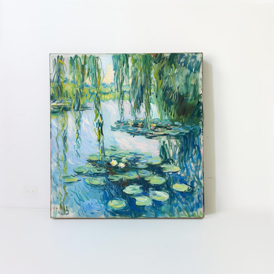 Framed pond artwork with green lily pads and reeds on canvas